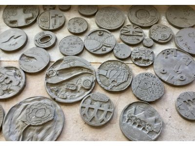 Clay Tiles carved by pupils drying