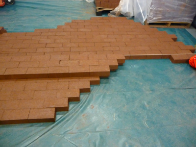 Laying out wet bricks in store room