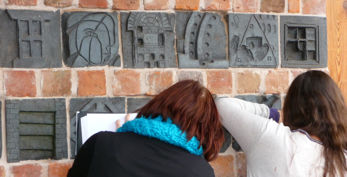 looking at brick carving