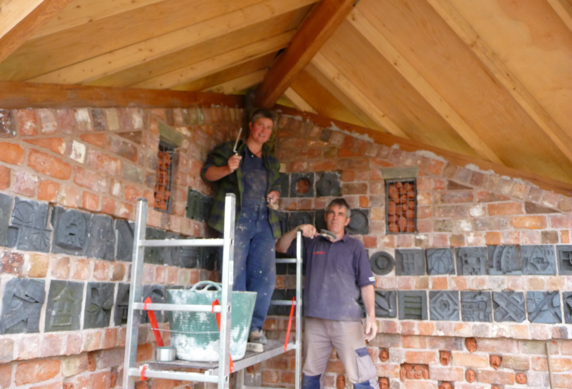Ruth and Huw pointing brickwork