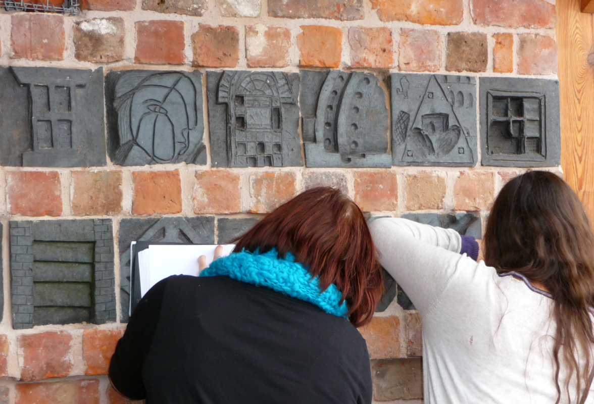 looking at brick carving