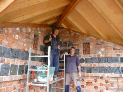 Ruth and Huw pointing brickwork