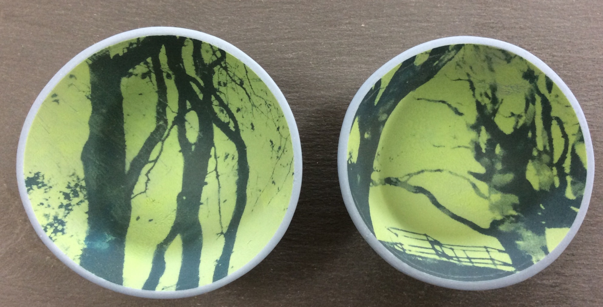Printed beech trees inside porcelain blue bowls