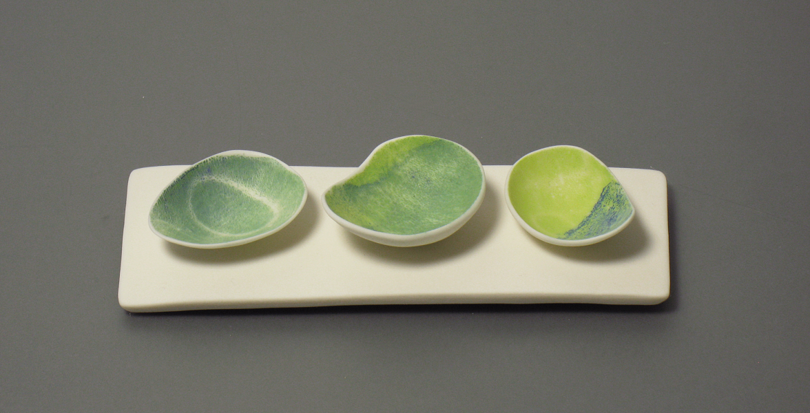 Three bowls on porcelain plinth