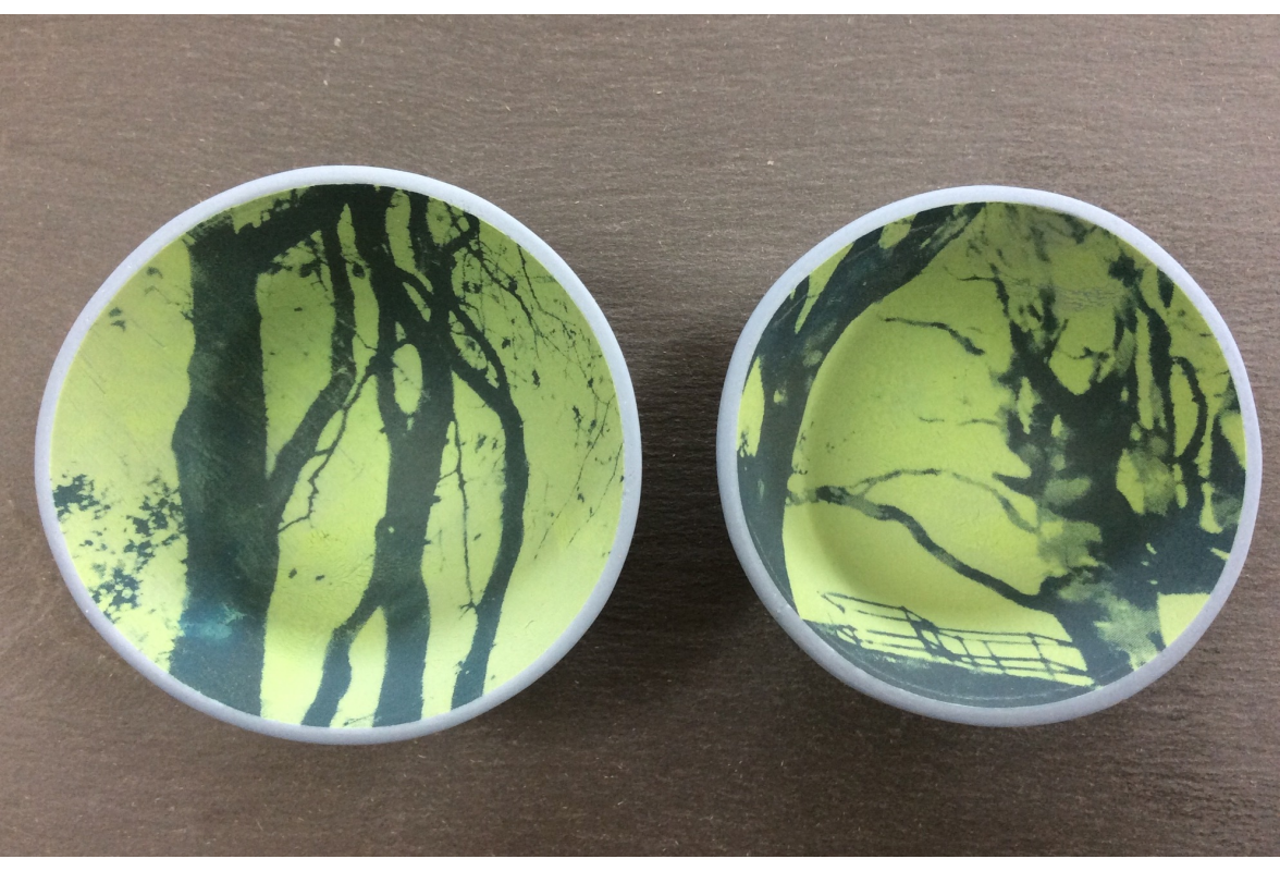Printed beech trees inside porcelain blue bowls