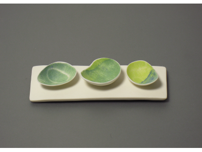 Three bowls on porcelain plinth