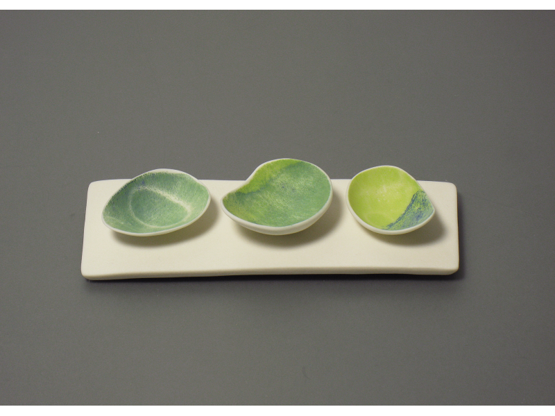 Three bowls on porcelain plinth