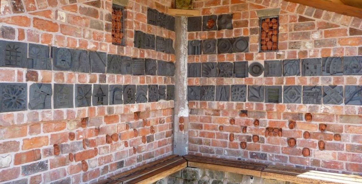 Carved brickwork inside the Bus shelter Cross House, Shropshire