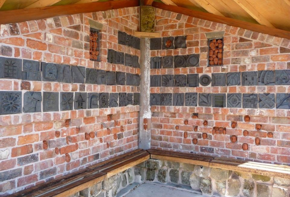 Carved brickwork inside the Bus shelter Cross House, Shropshire