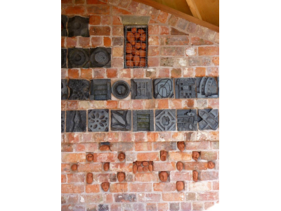 Detail of brick carvings and heads made in ceramic workshops
