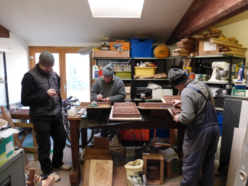 Carving bricks in studio