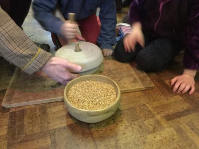 grinding corn using a quern