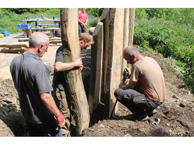 Working the planks into the grouns