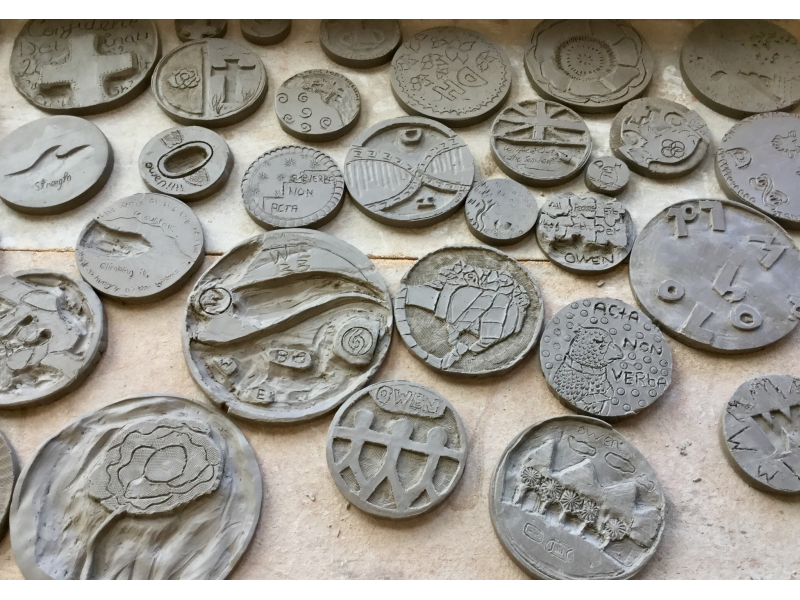 Clay Tiles carved by pupils drying