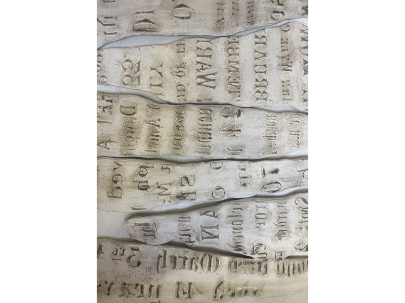 Decal of gravestone clay textures printed onto porcelain